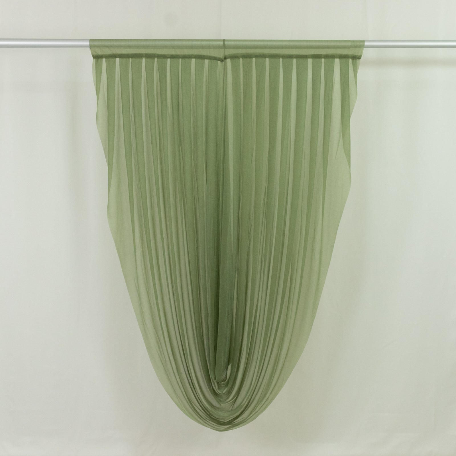 Dusty sage green sheer chiffon valance curtain draped elegantly.