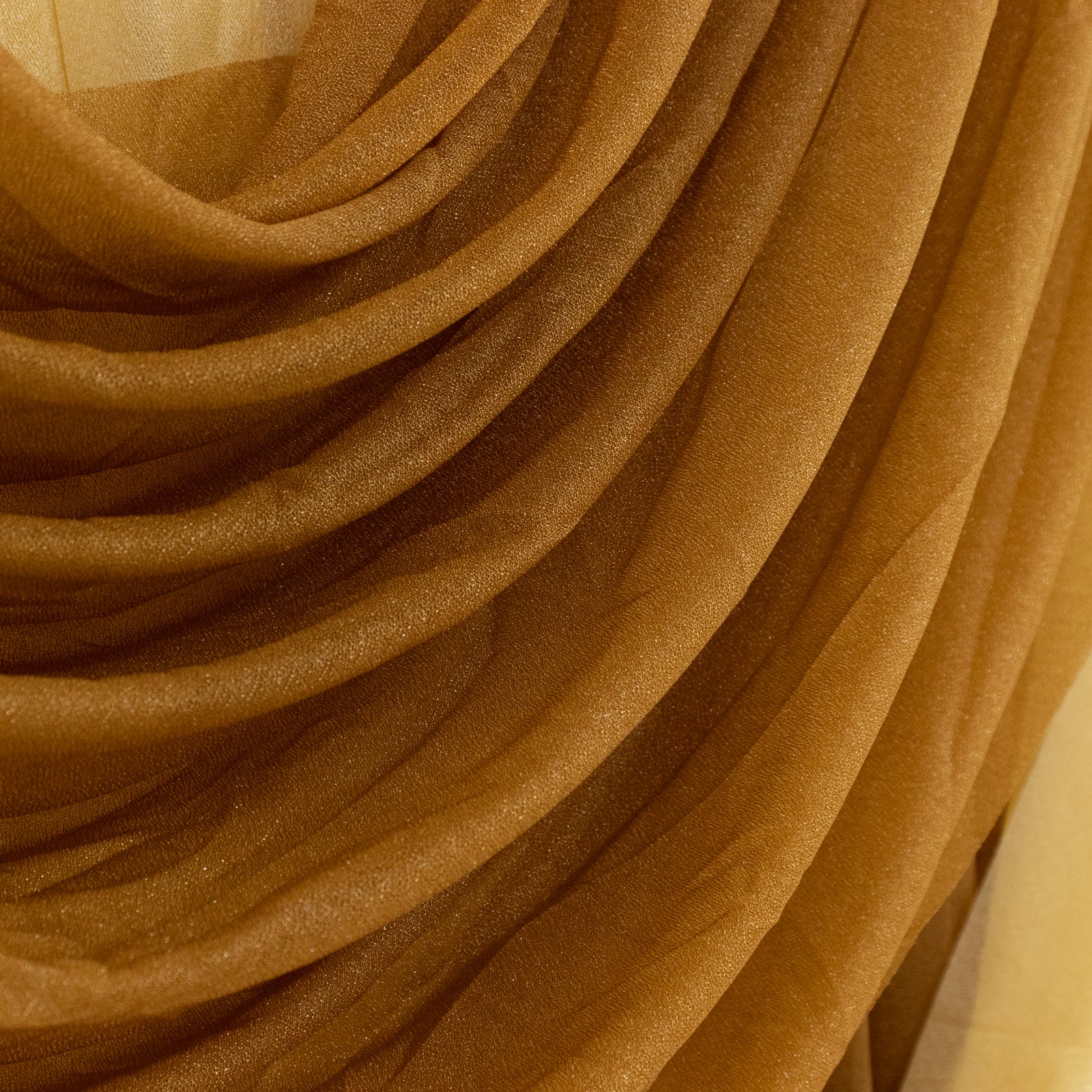 Gold sheer fabric draped elegantly