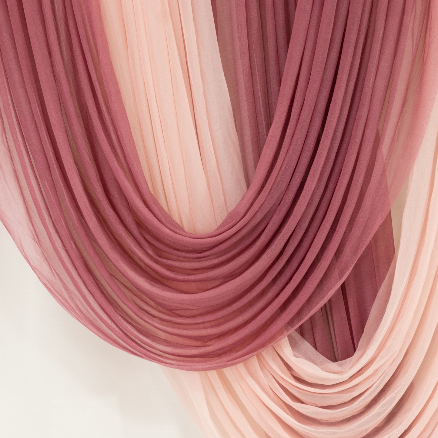 Mauve sheer chiffon valance curtain draped elegantly.