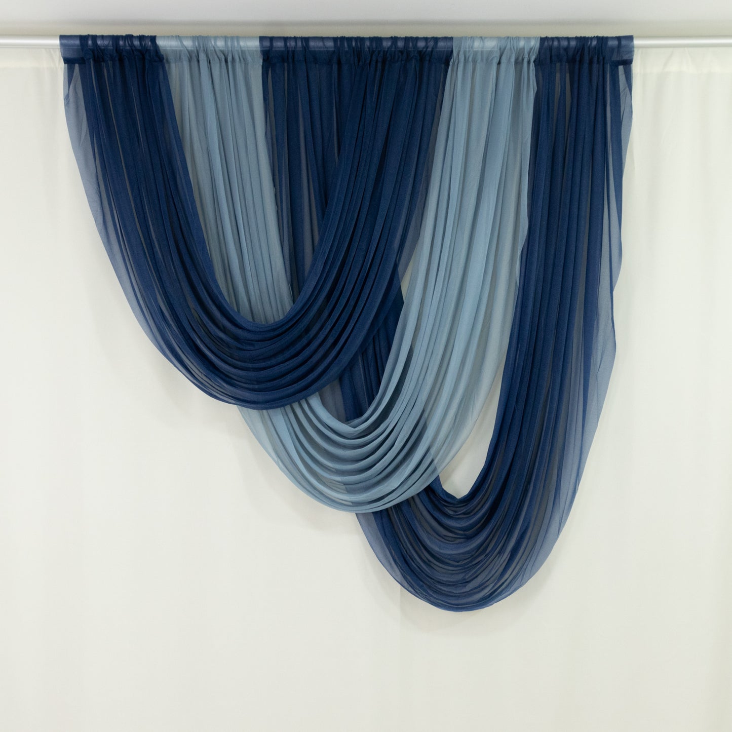 Navy blue sheer drapery fabric with flowing