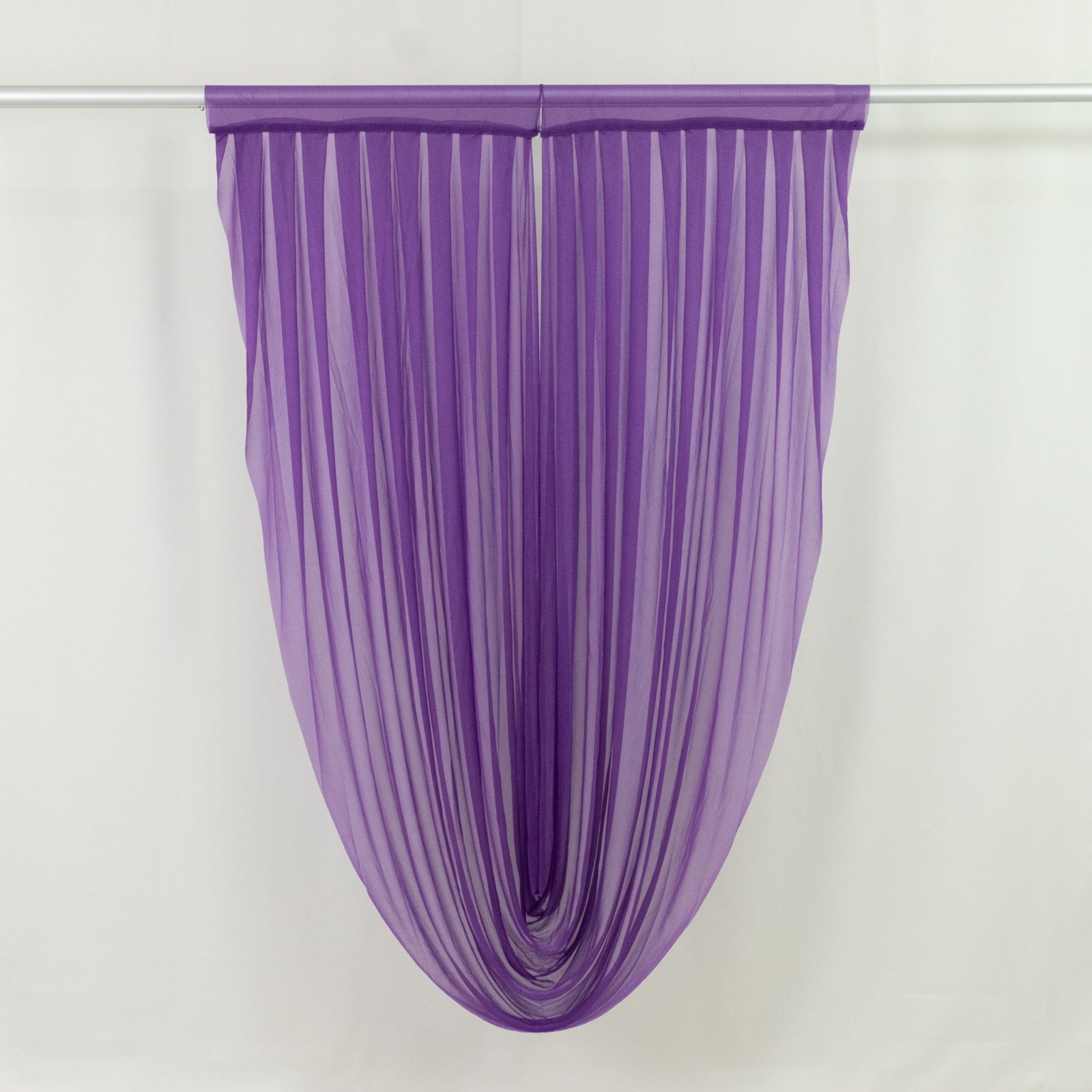 Purple sheer chiffon curtain draped elegantly, perfect for weddings and events.