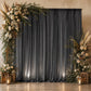 Black chiffon backdrop curtain panel with sheer draping fabric.