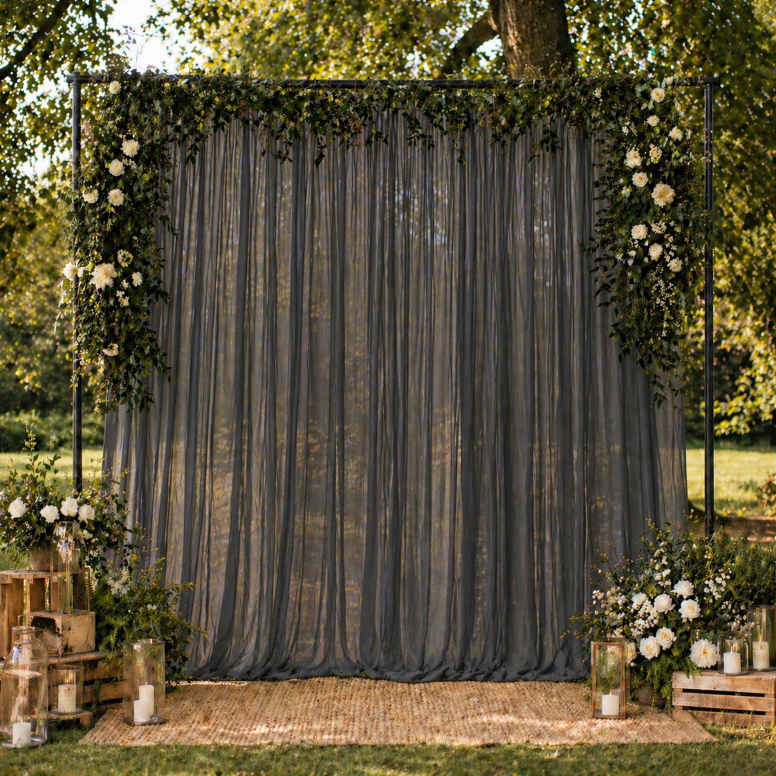 Black chiffon backdrop curtain panel with sheer draping fabric.