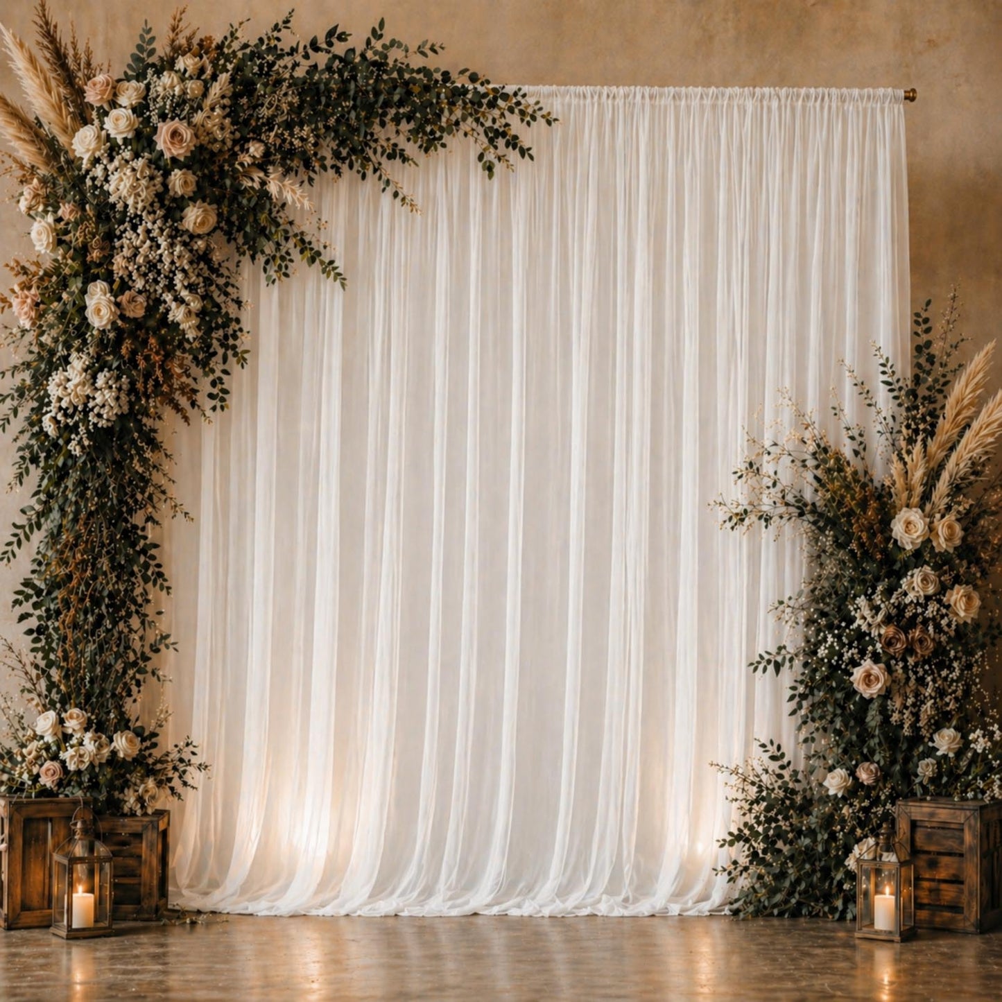 White chiffon backdrop curtain panel with floral arrangement and soft lighting.