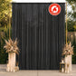 Black chiffon backdrop curtain panel in a decorative setting.