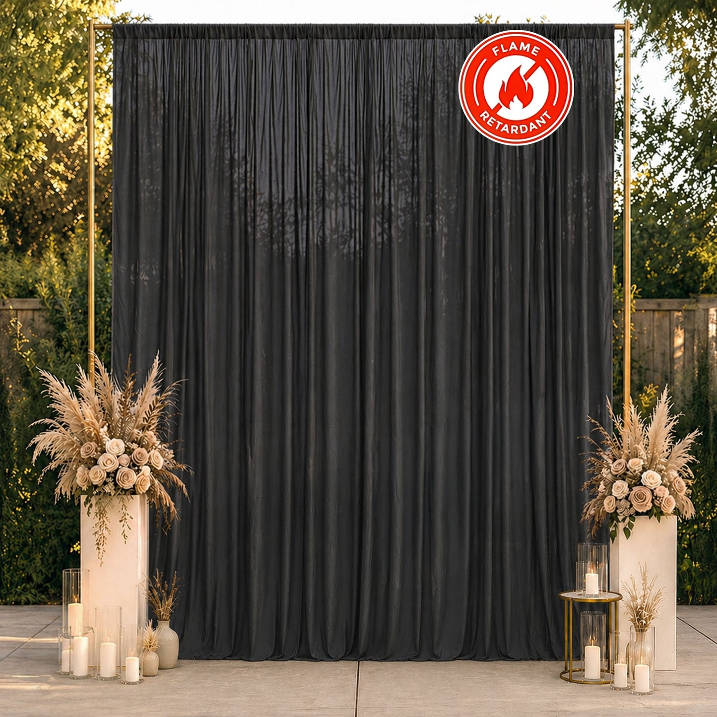 Black chiffon backdrop curtain panel in a decorative setting.