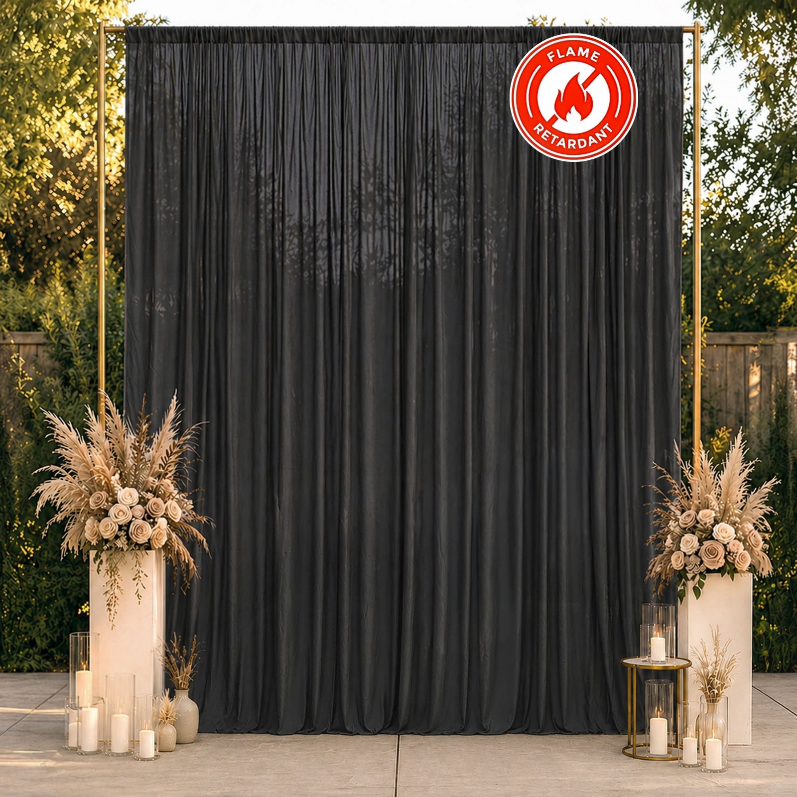 Black chiffon backdrop curtain panel in a decorative setting.