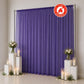 Purple flame retardant sheer curtain backdrop with candles and floral decor