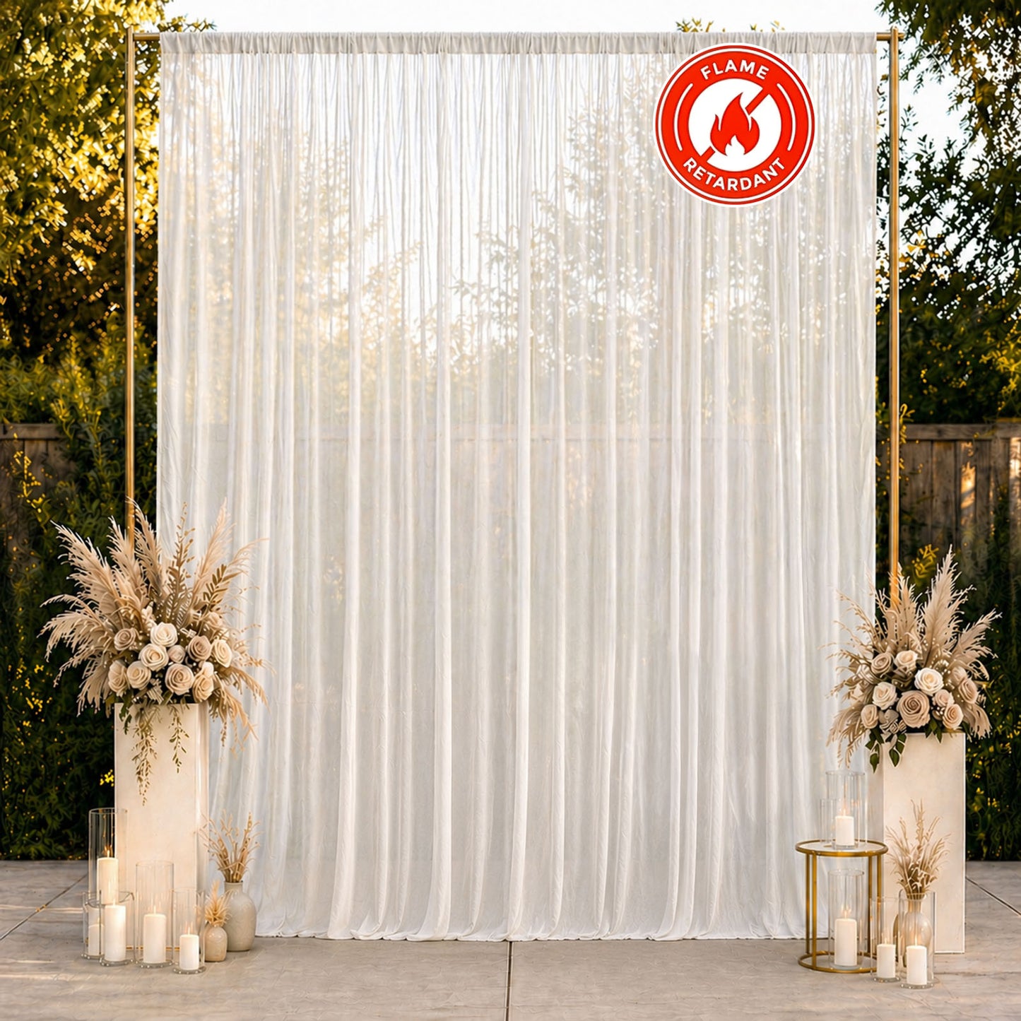 White chiffon backdrop curtain panel with elegant draping and floral decor.