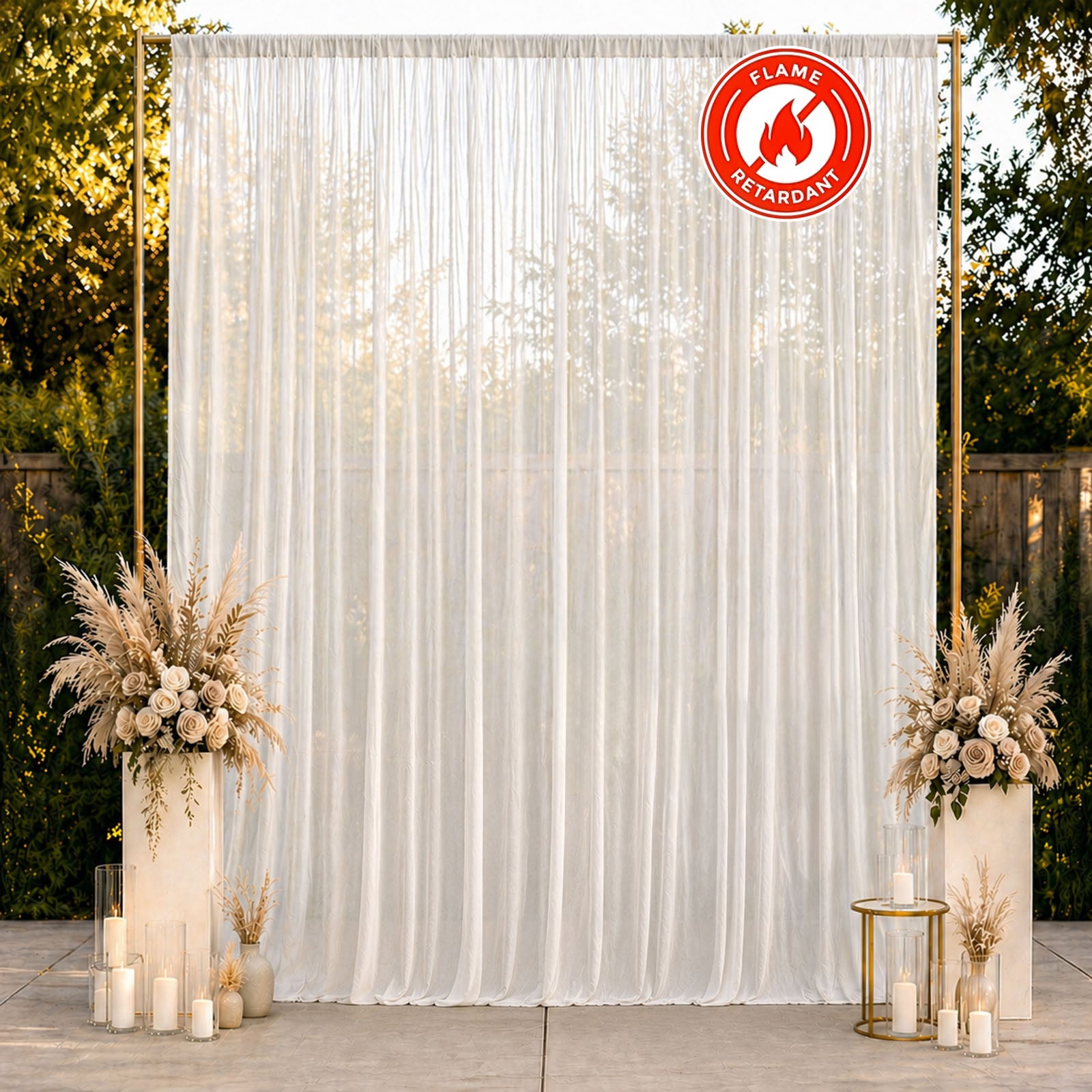 White chiffon backdrop curtain panel with elegant draping and floral decor.