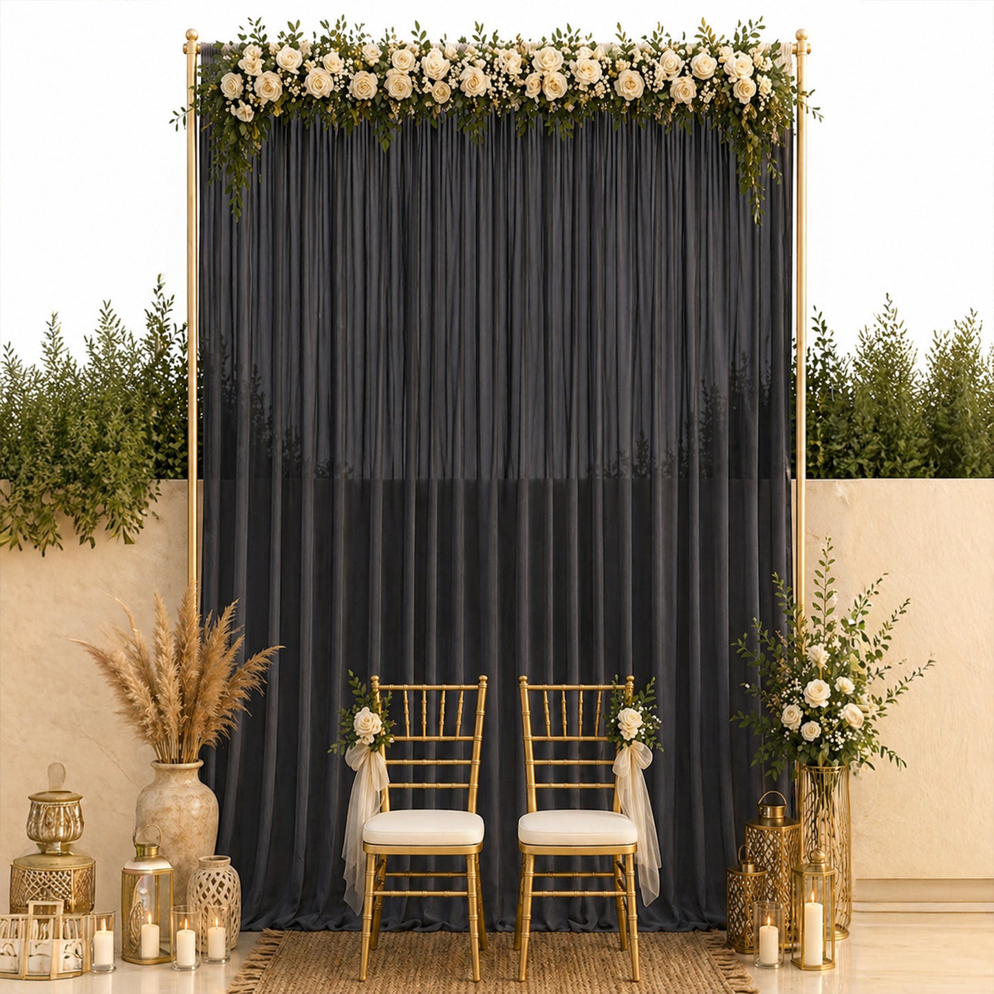 Black chiffon backdrop curtain panel with elegant floral decor and gold chairs.