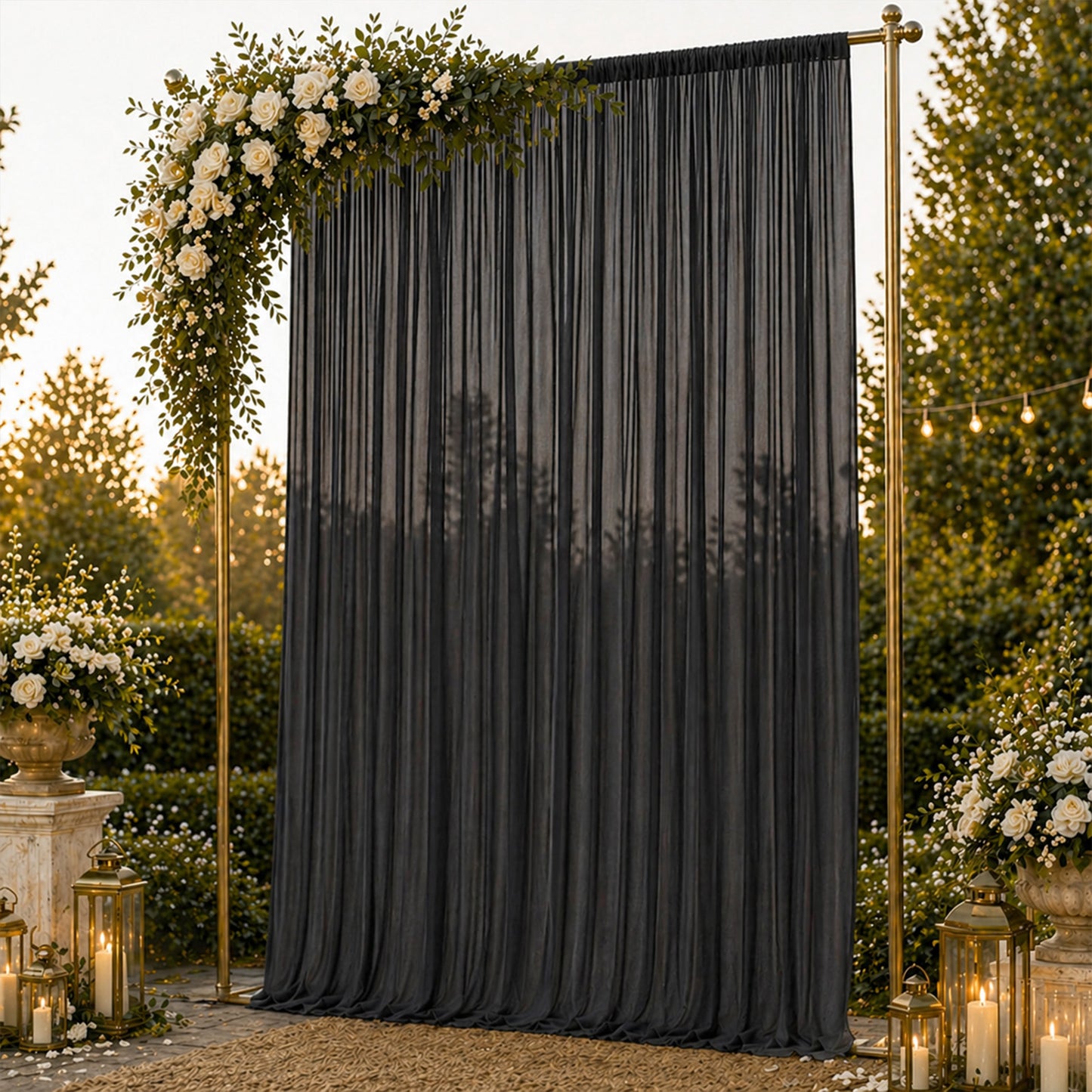 Black chiffon backdrop curtain panel with sheer draping and rod pocket.