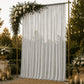 Silver chiffon backdrop curtain panel with sheer draping fabric.
