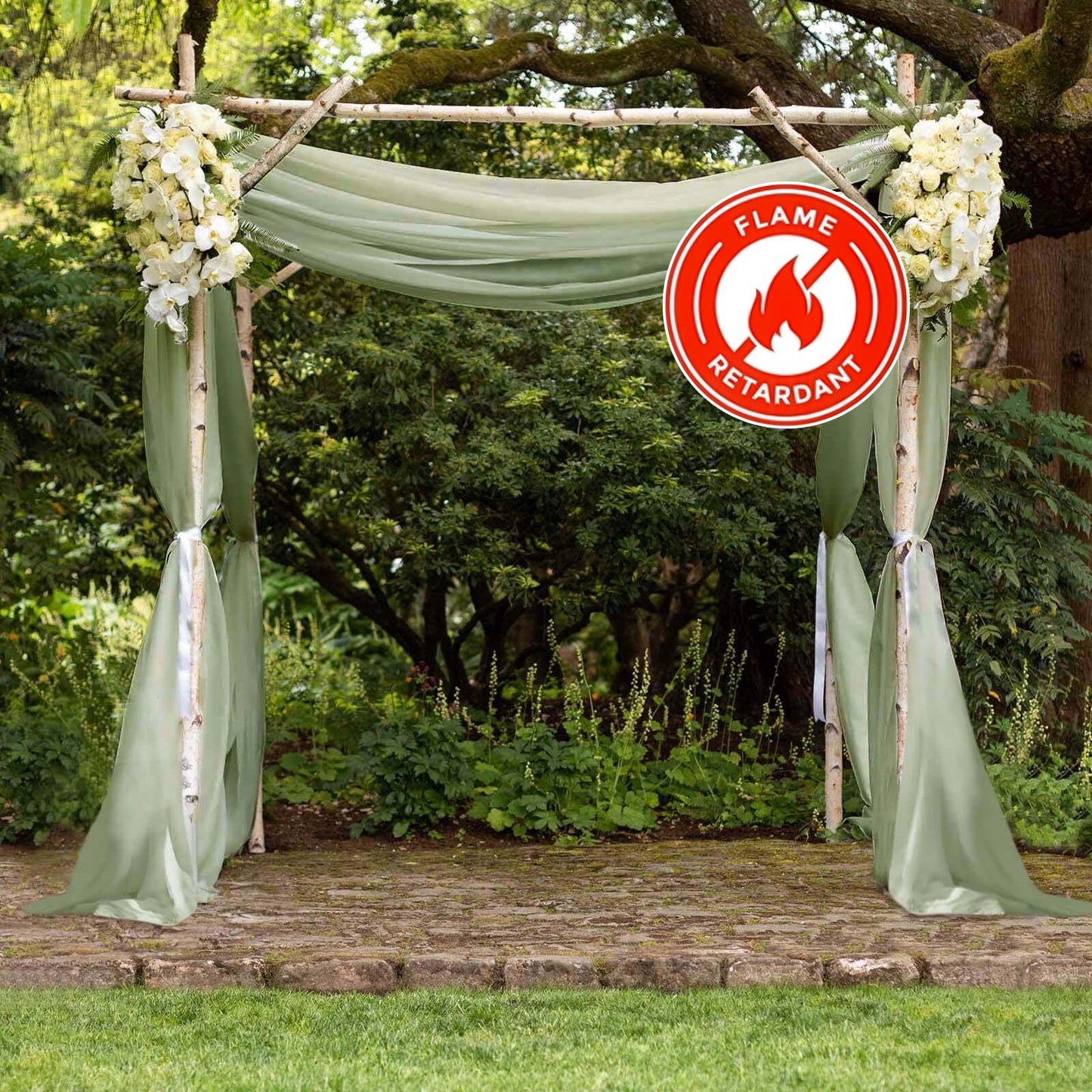 Dusty sage green chiffon curtain panel draped elegantly in a garden setting.
