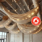 Natural chiffon curtain panel in soft beige with twinkling lights.