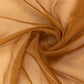 Gold chiffon curtain panel, durable and flame resistant backdrop drapery.