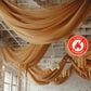 Gold chiffon curtain panel drapery, flame resistant backdrop for elegant decor.