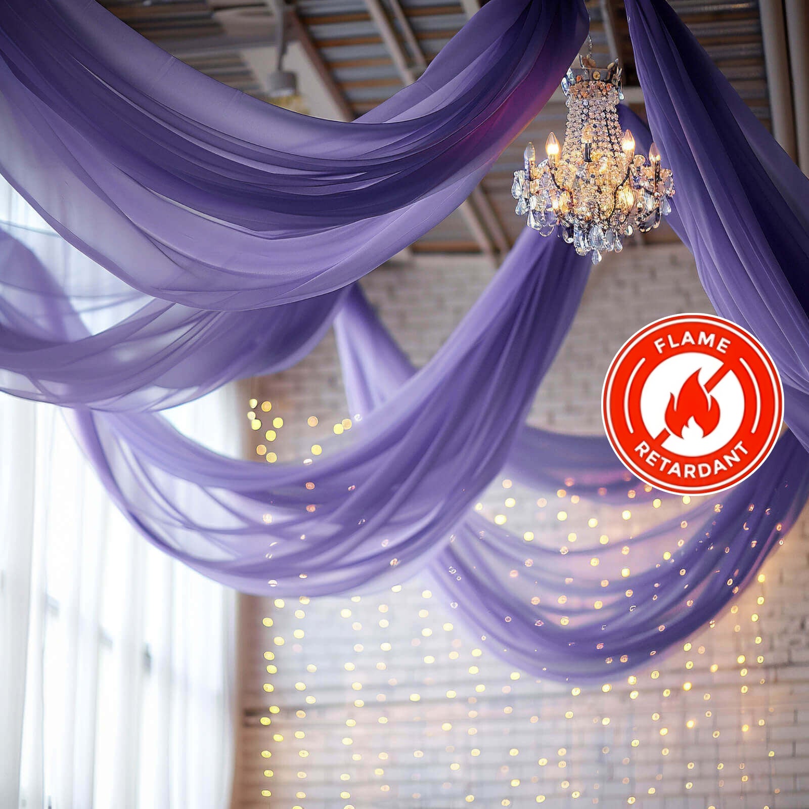 Purple chiffon curtain panel draping elegantly with a chandelier above.