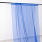 5ftx32ft royal blue chiffon curtain panel hanging from a black rod.