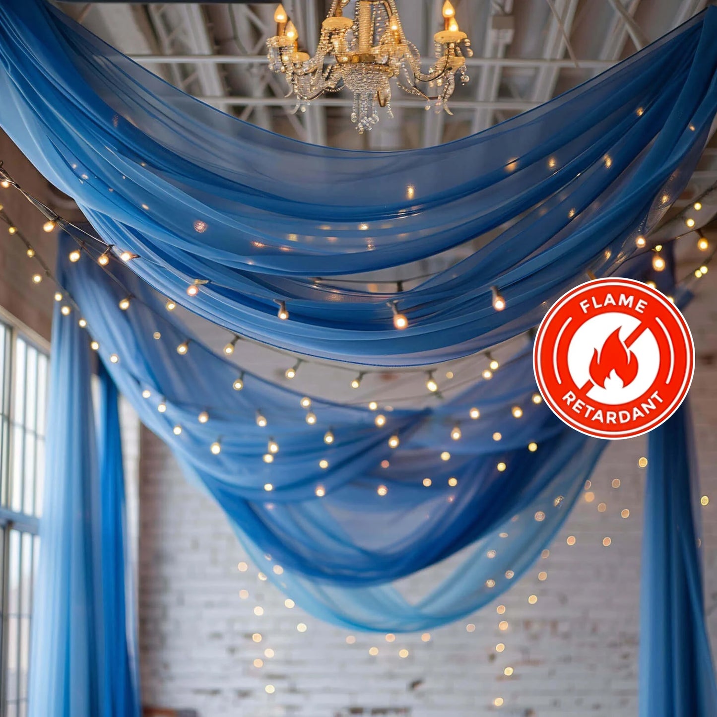 Royal blue chiffon curtain panel draped elegantly with lights.