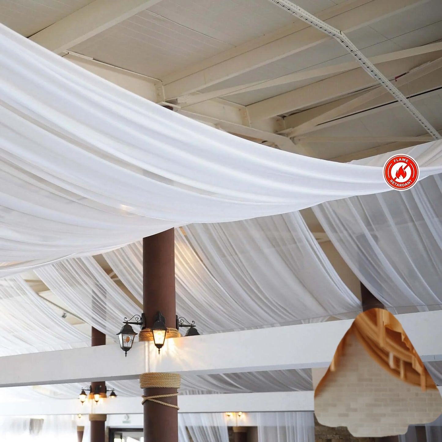White chiffon curtain panel drapery hanging from the ceiling.