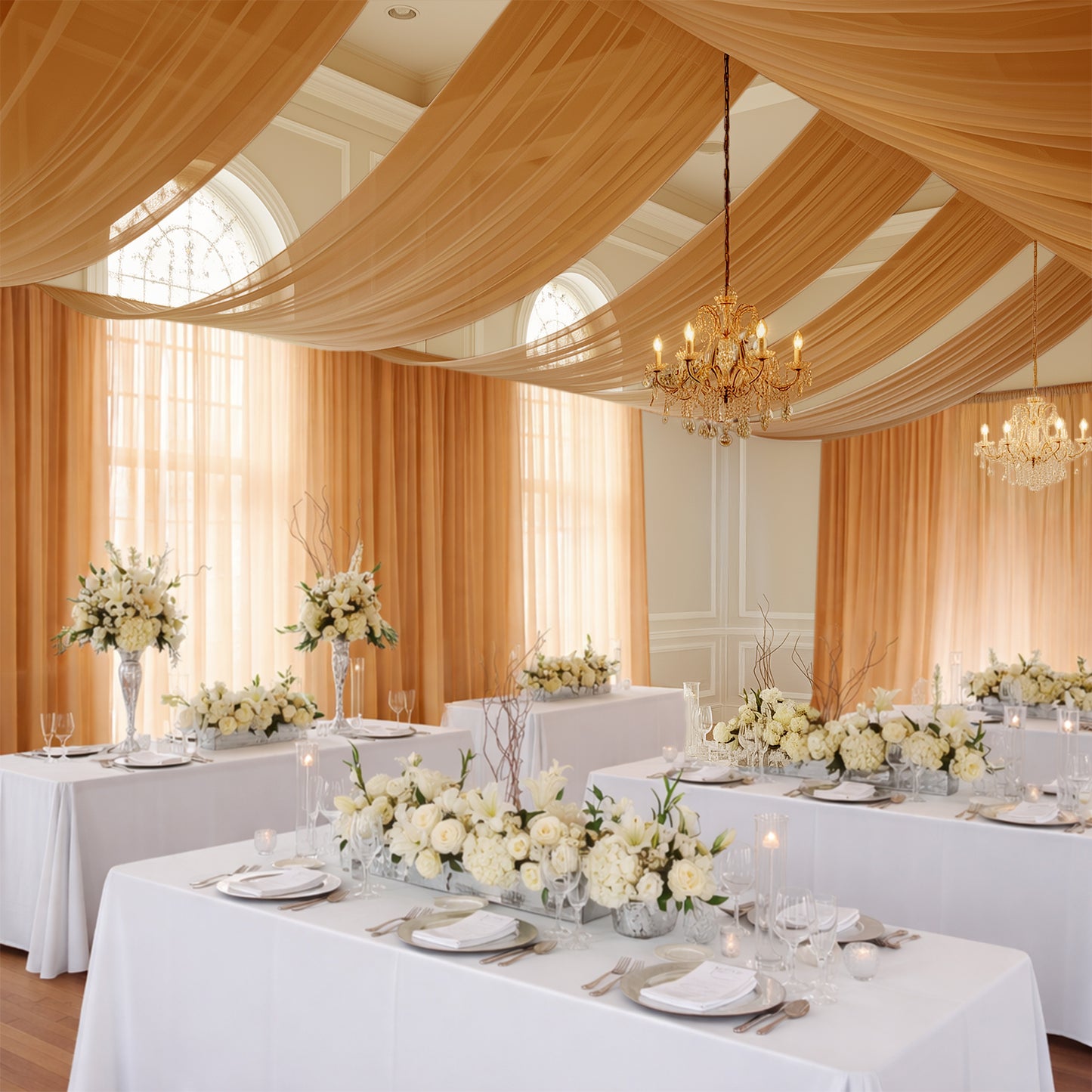 Gold chiffon curtain panel draping elegantly in a beautifully decorated event space.