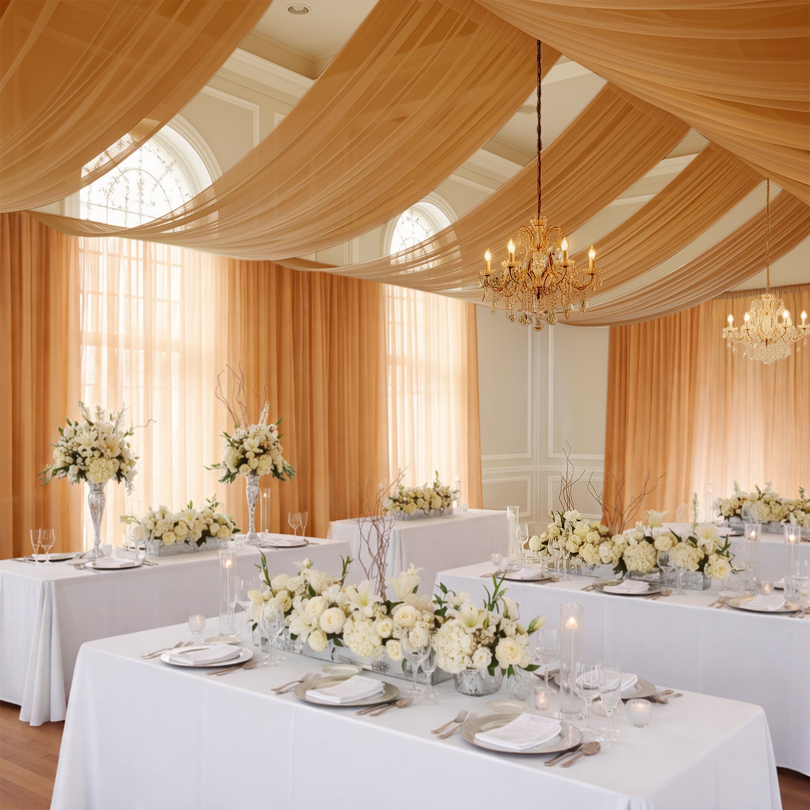 Gold chiffon curtain panel draping elegantly in a beautifully decorated event space.