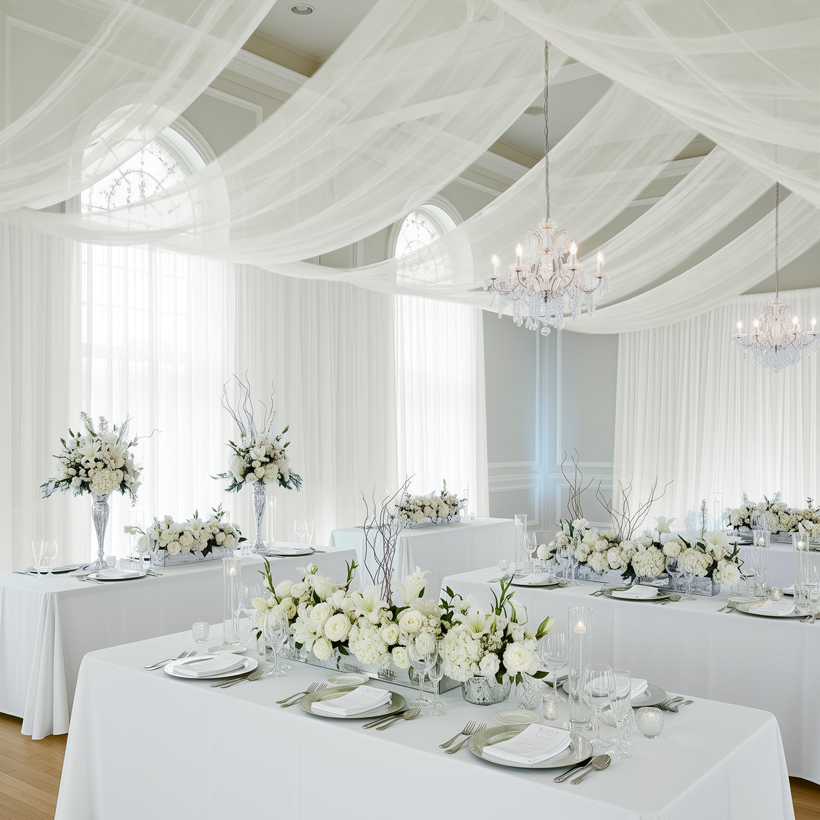 Ivory chiffon curtain panel draping elegantly in a bright, airy setting.