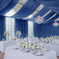 Navy blue chiffon curtain panel draped elegantly in a decorated event space.