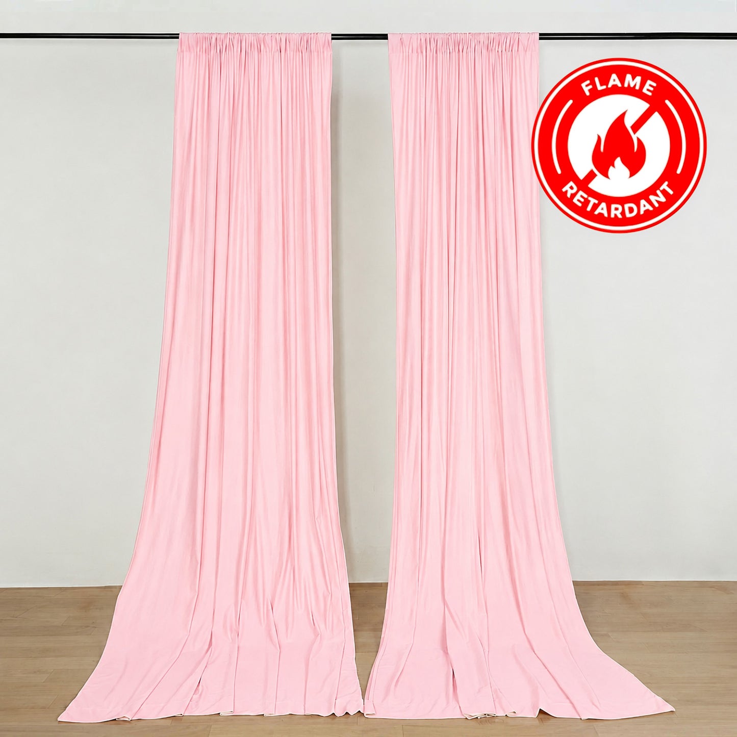 Blush polyester backdrop drape curtains for events, wrinkle-free and flame resistant.