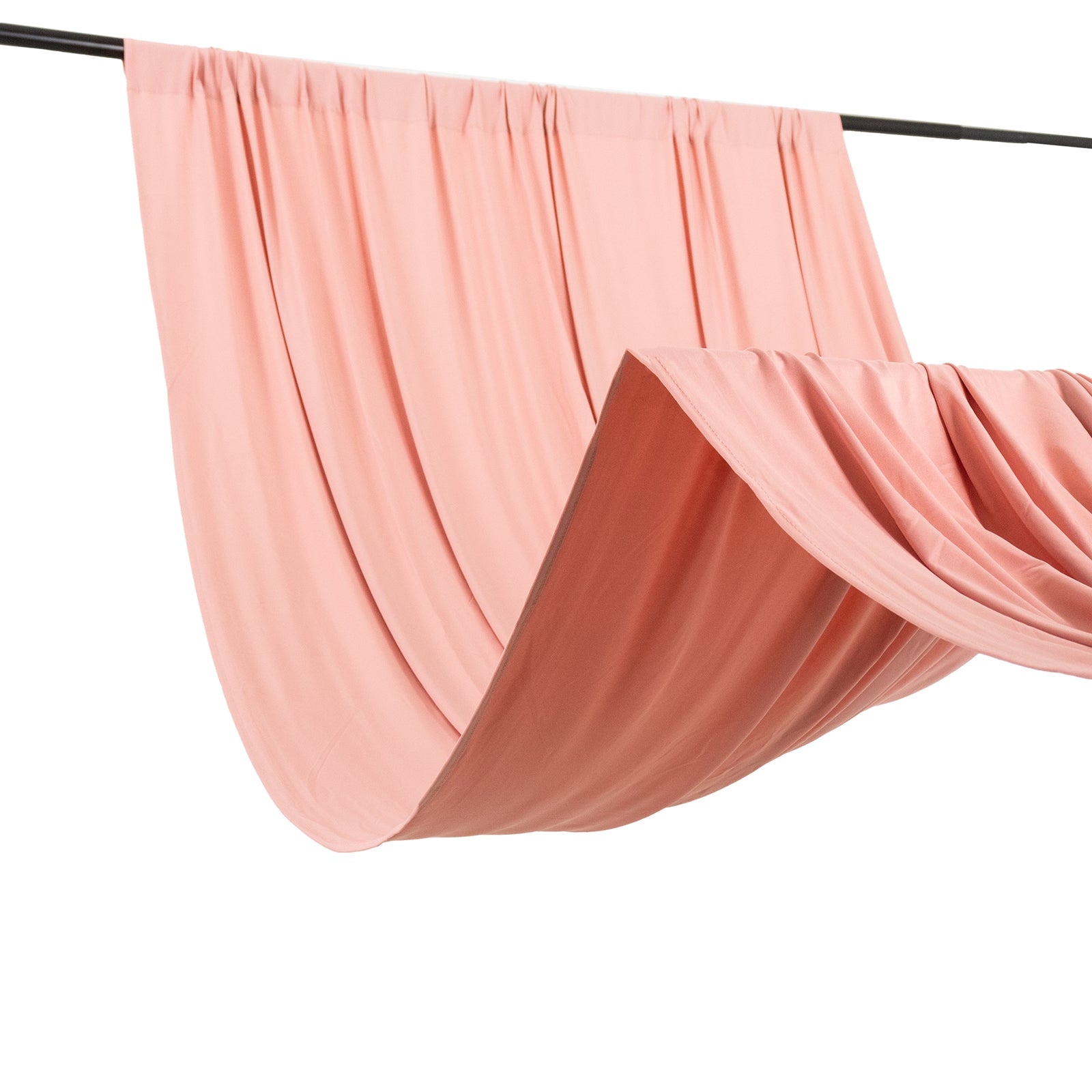 Dusty rose 4-way stretch spandex event curtain drapes on a rod.