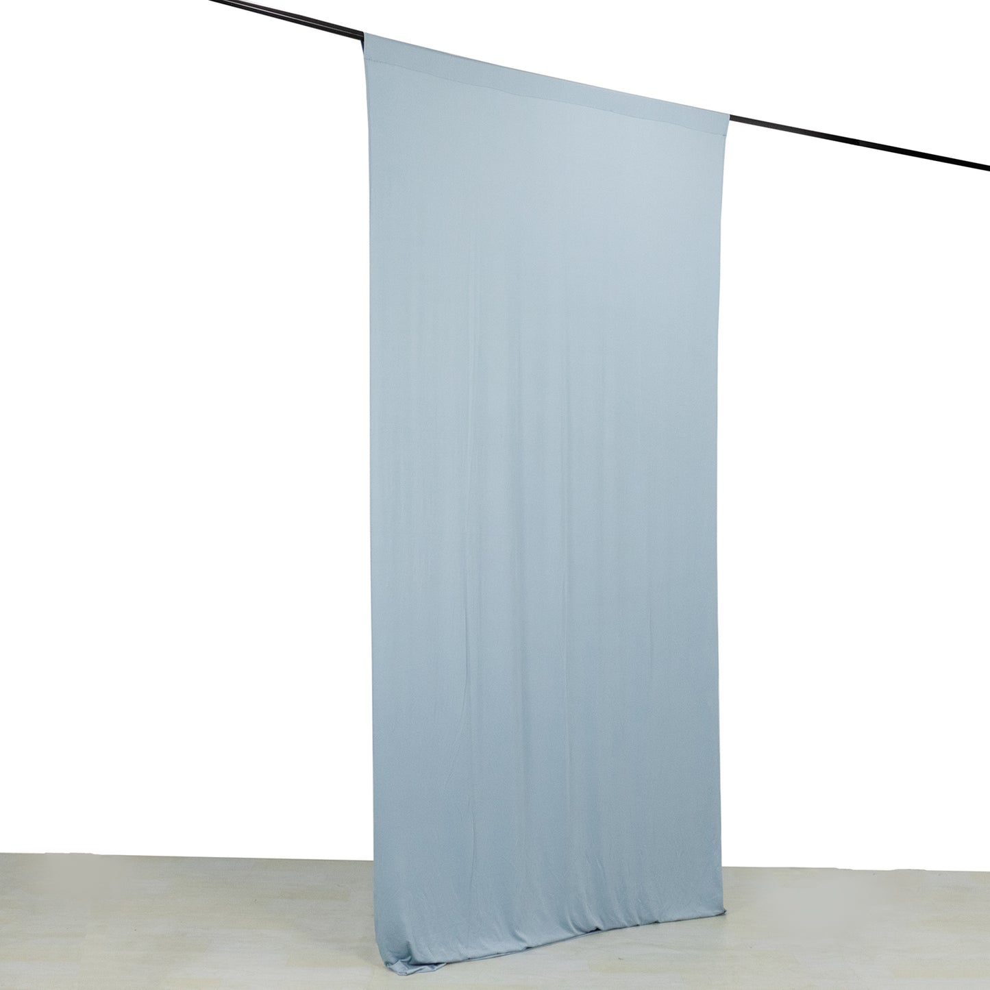 Dusty blue 4-way stretch spandex event curtain drape on rod.