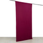 Burgundy 4-way stretch spandex event curtain drape on a rod.
