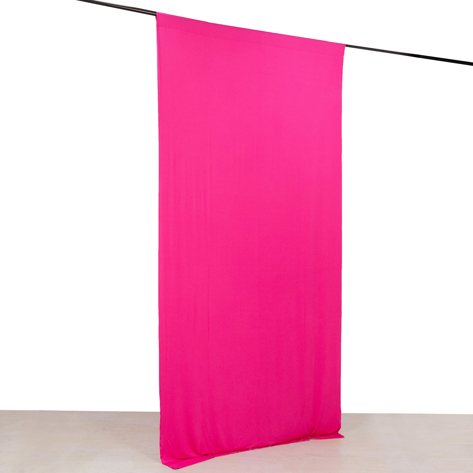 Fuchsia 4-way stretch spandex event curtain drapes on a rod.