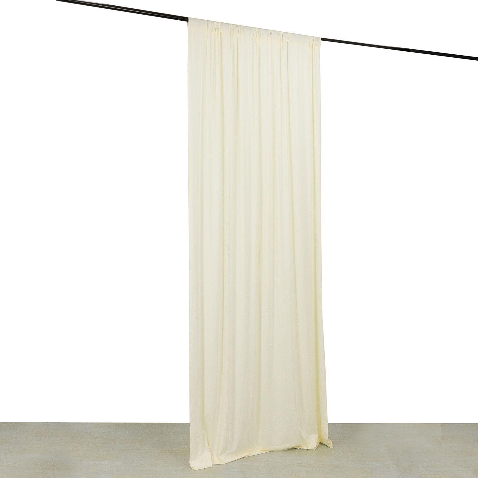 Ivory 4-way stretch spandex event curtain drapes hanging on a rod.