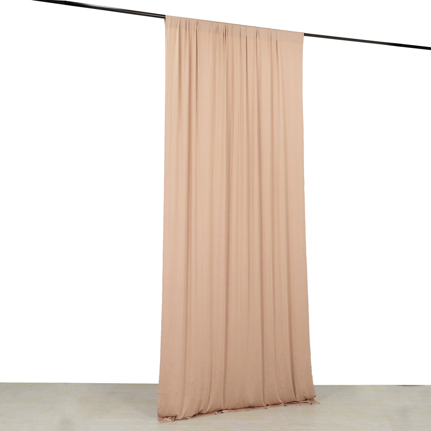 Nude 4-way stretch spandex event curtain drapes hanging on a rod.