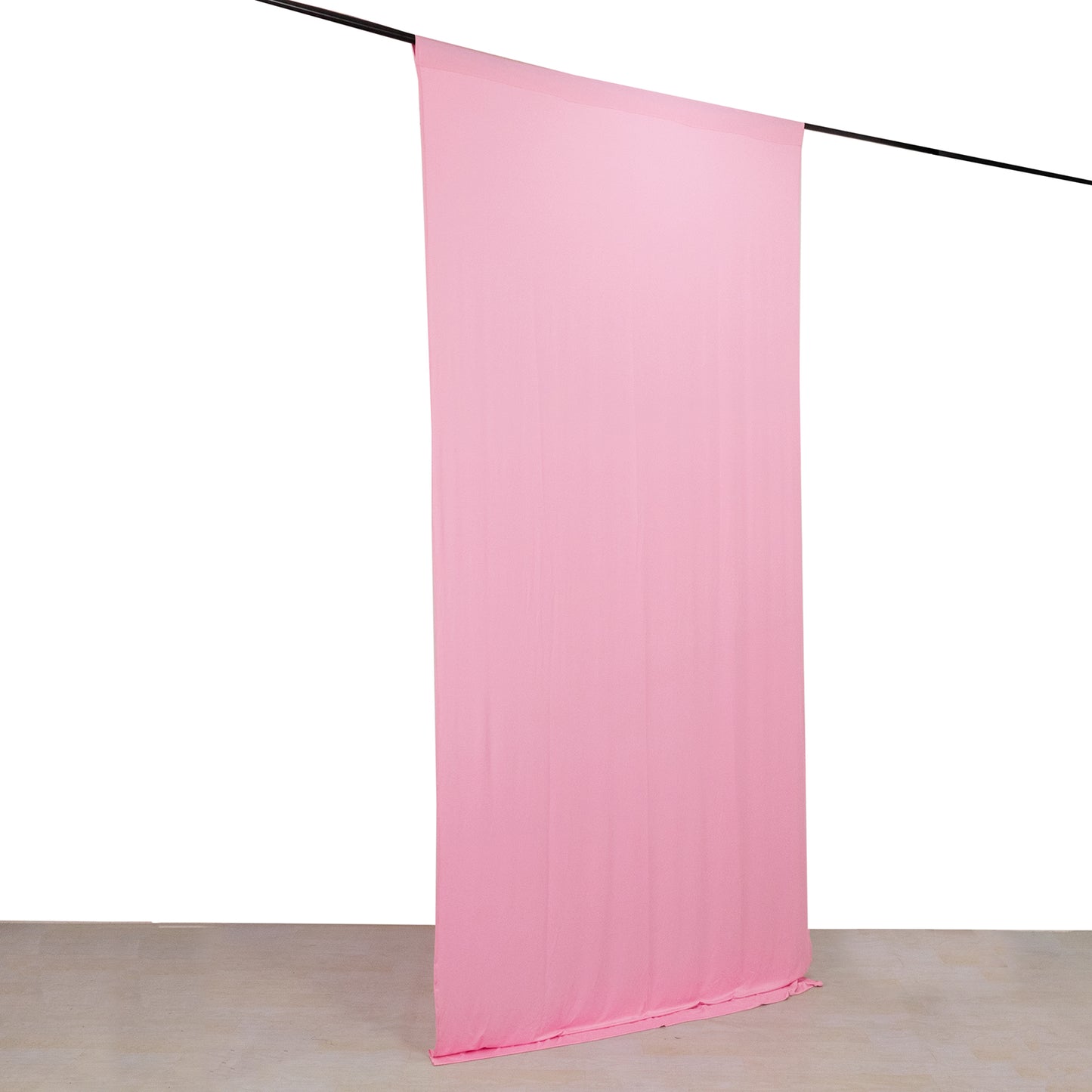 Pink 4-way stretch spandex event curtain drapes hanging on a rod.