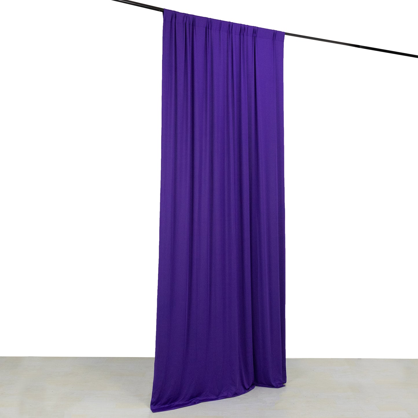 Purple 4-way stretch spandex event curtain drapes with rod pockets.