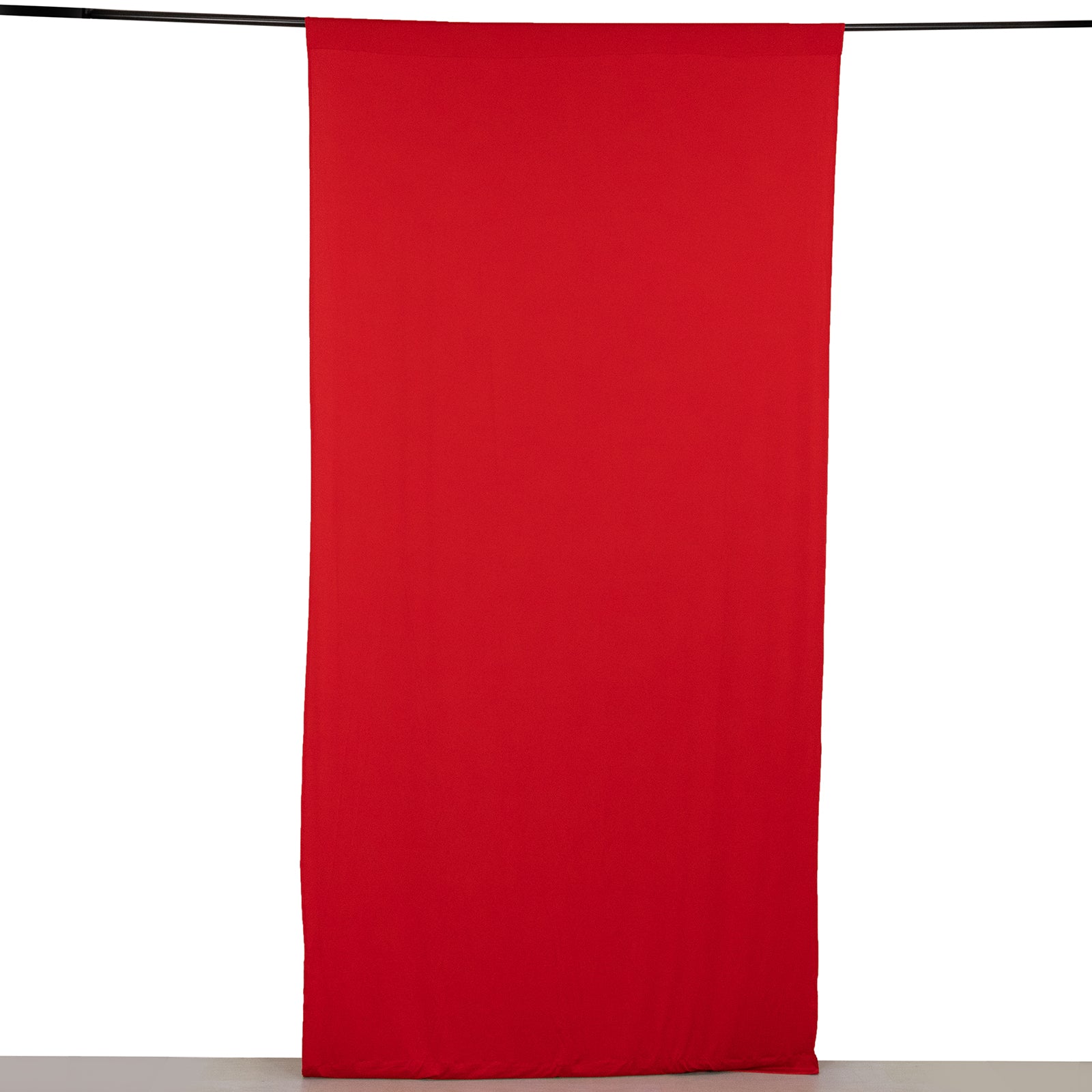 Red 4-way stretch spandex backdrop curtain drape with rod pockets.