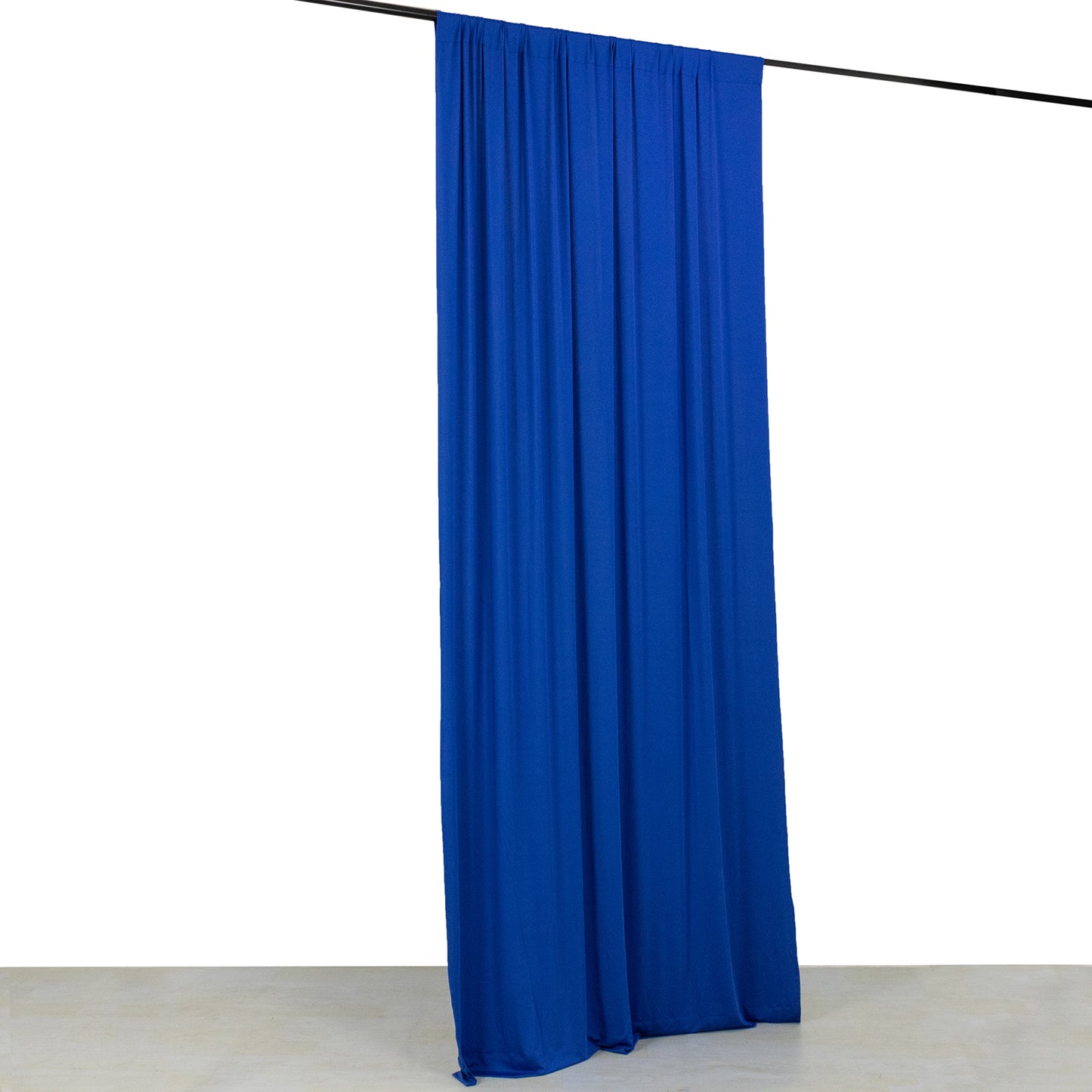 Royal Blue 4-Way Stretch Spandex Event Curtain Drapes on a backdrop.