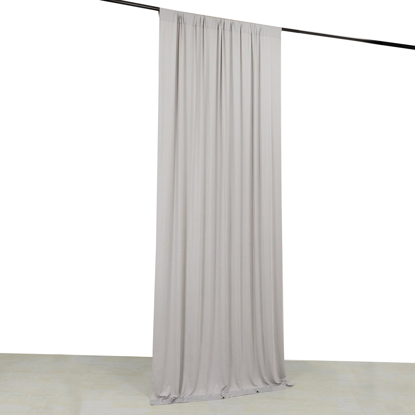 Silver 4-way stretch spandex event curtain drapes hanging on a rod.
