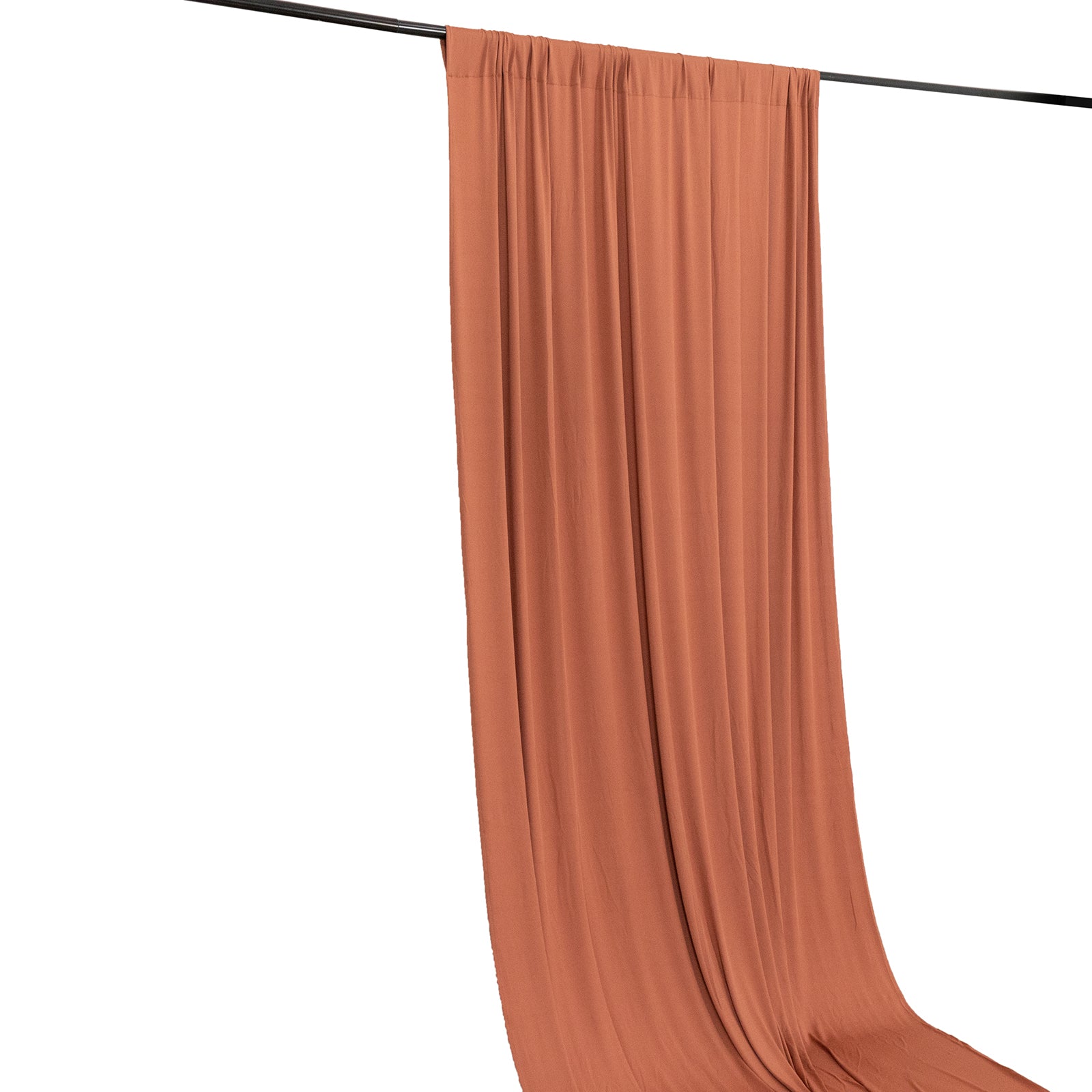Terracotta 4-way stretch spandex event curtain drapes on a rod.