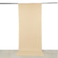 Beige 4-way stretch spandex event curtain drapes hanging as a backdrop.
