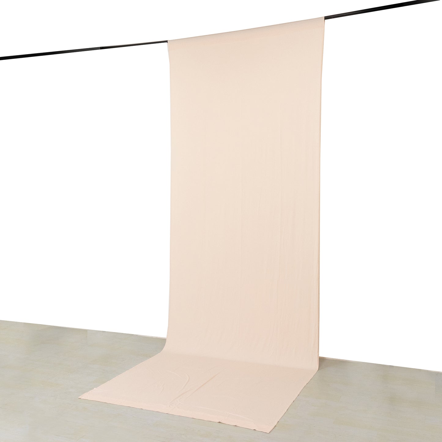 Blush 4-way stretch spandex curtain drape backdrop on a rod.