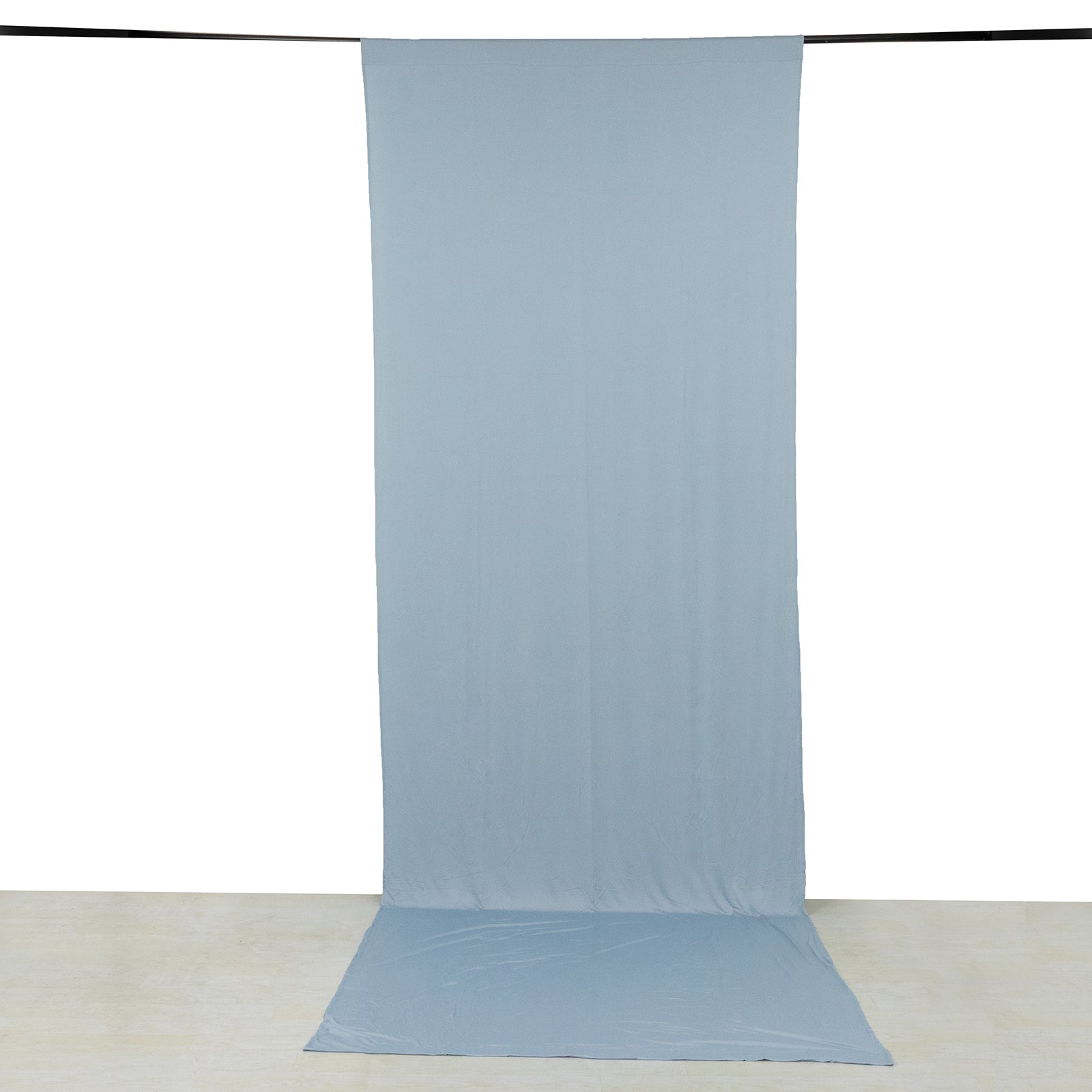 Dusty blue 4-way stretch spandex event curtain drape with rod pockets.