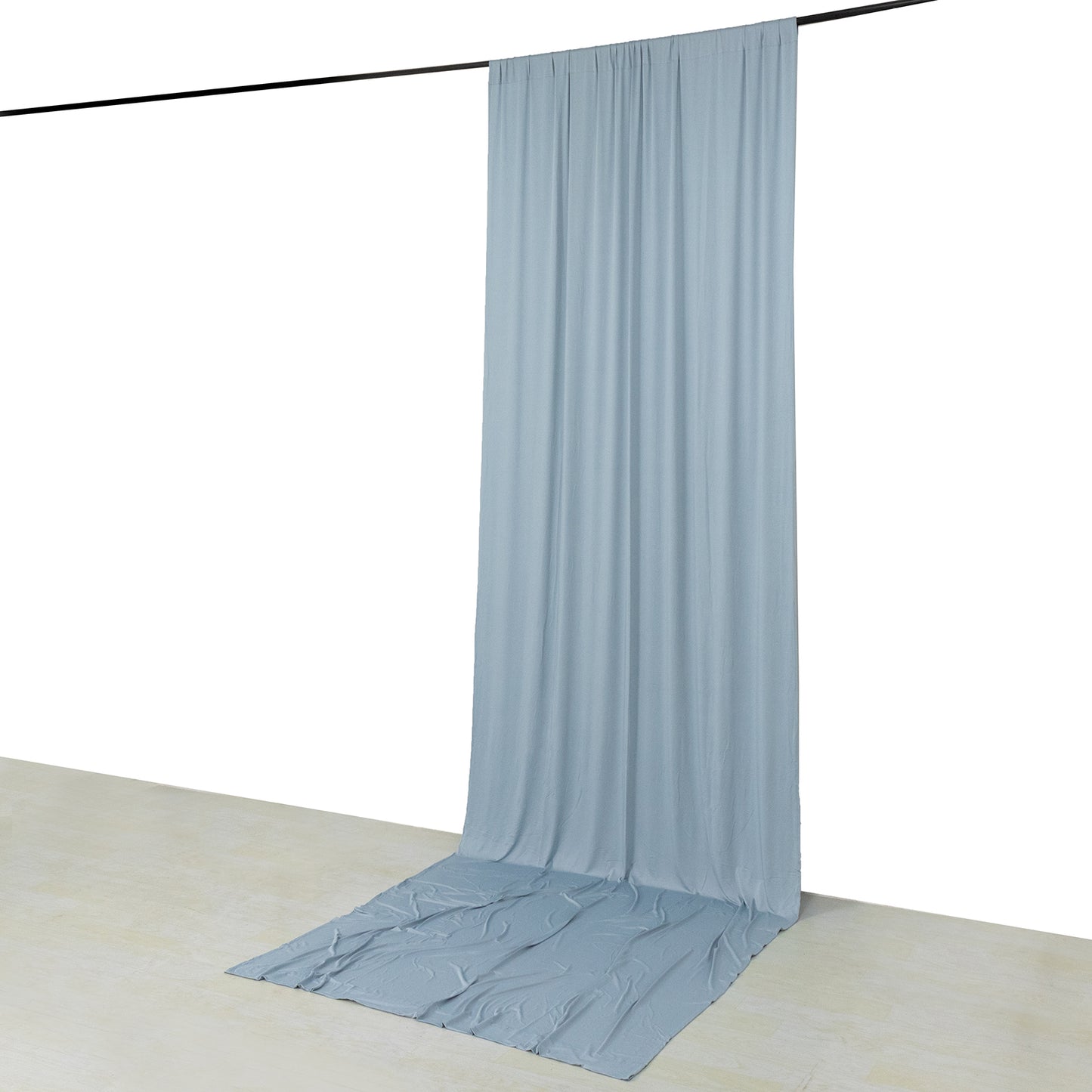 Dusty blue 4-way stretch spandex event curtain drapes hanging elegantly.