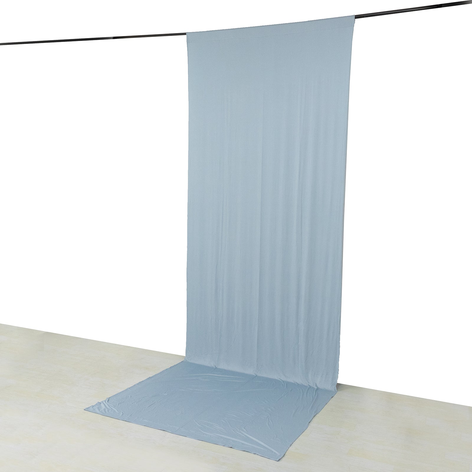 Dusty blue 4-way stretch spandex event curtain drapes hanging backdrop.