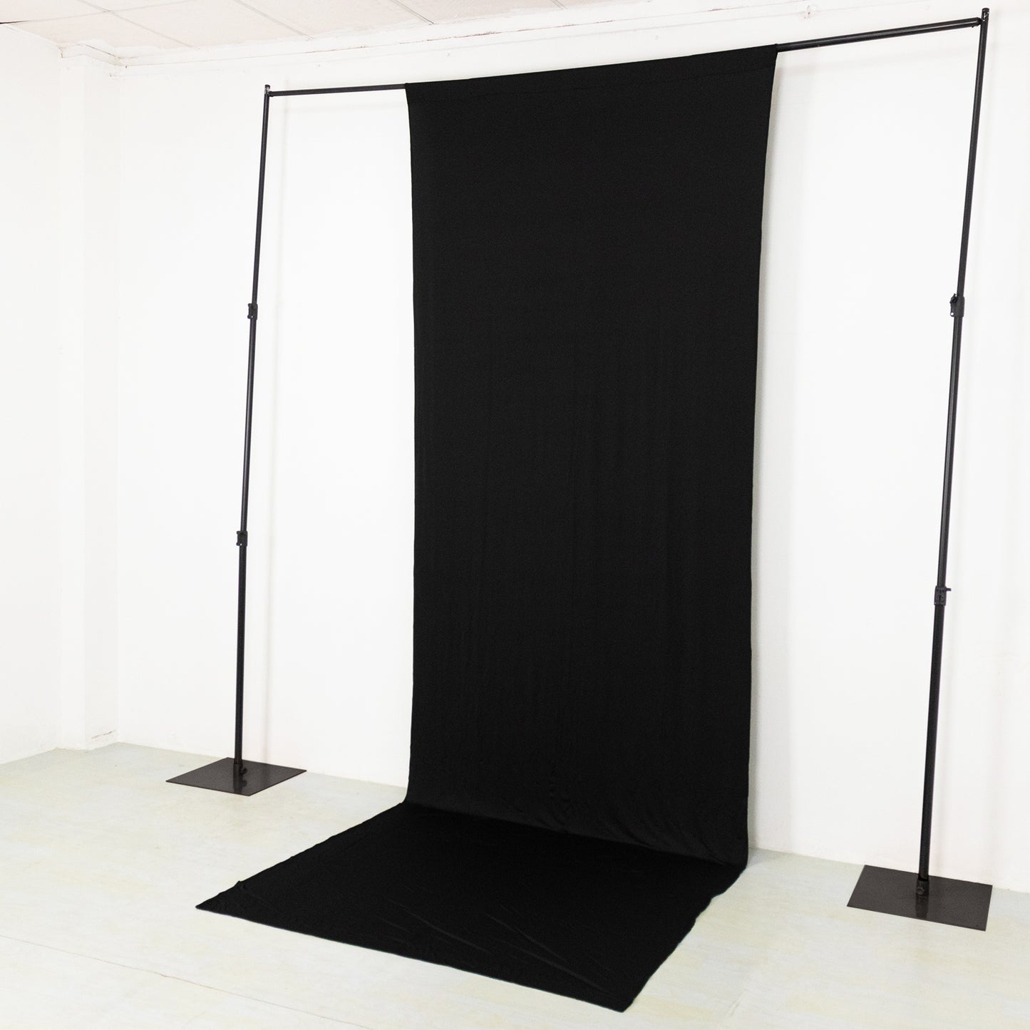 Black 4-way stretch spandex event curtain drapes backdrop panel.