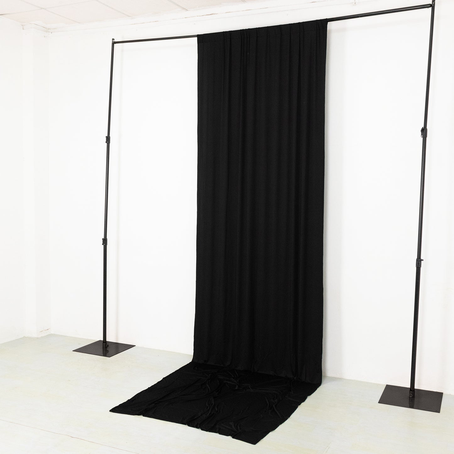 Black 4-way stretch spandex event curtain drapes backdrop panel.