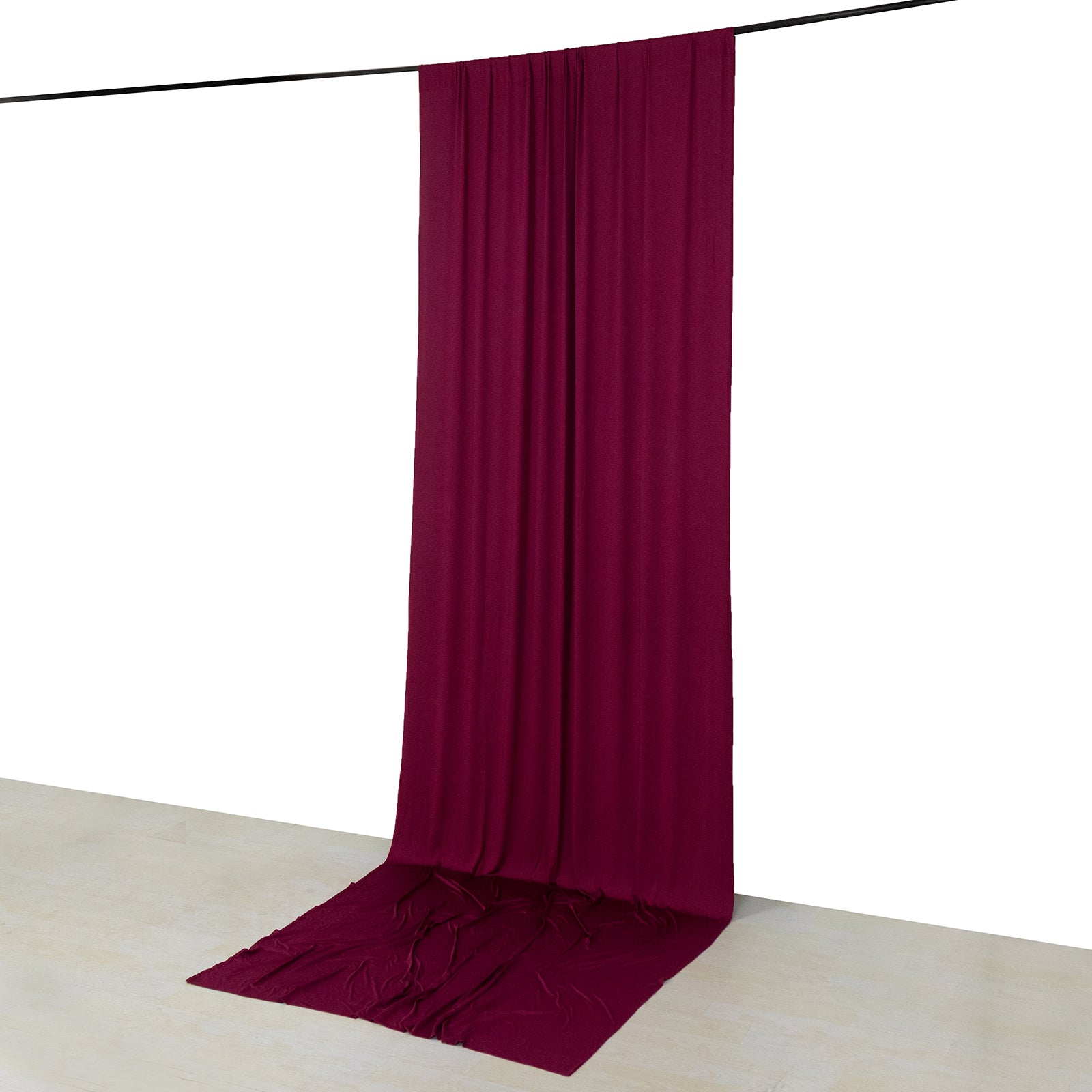 Burgundy 4-way stretch spandex event curtain drapes hanging from a rod.